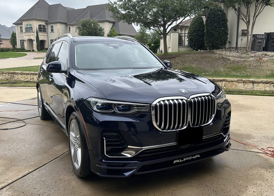 Freshly detailed SUV exterior in a driveway