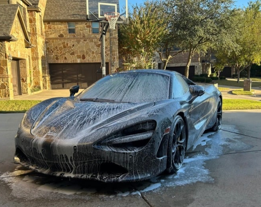 Supercar being foam washed during an exterior detail